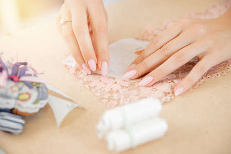 Sewing underwear process. Seamstress tailor in manufacturing fabricの写真素材
