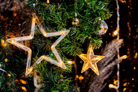 Garland in shape of Led Christmas star in decor, blurred bokeh background