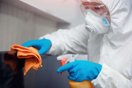 Medical staff cleaning and disinfection with antiseptics of viruses and germs, cleaner service against coronavirusの写真素材