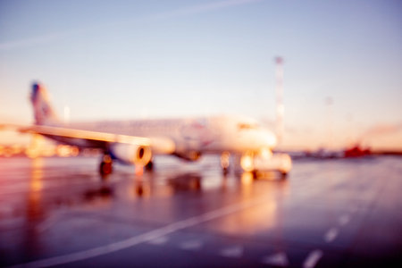 Abstract Blur background of airplane airport against sun light waiting for passengersの写真素材