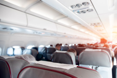 abstract background, airport aircraft cabin, seats with people.