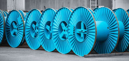 Set Empty metal copper coil spools for winding wire or cable into reelの写真素材