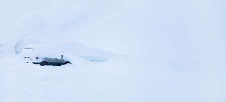 Blocked cars in parking lot after snow storm, winter frostの写真素材