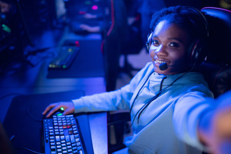 Streamer beautiful African American girl make selfie photo professional gamer playing online games...