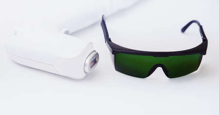 Body ipl epilation concept. Banner device laser hair removal, light backgroundの写真素材