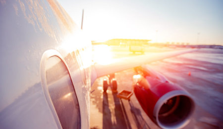 Abstract Blur background of airplane airport against sun light waiting for passengers