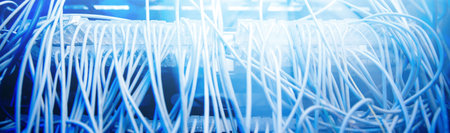 Concept internet data center blue background. Banner fiber cable on network switches optical...