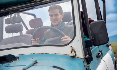 Happy lonely man travel by car in cabriolet to sea. Concept summer trip vacation, realize dream
