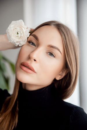 Caucasian Fashion portrait of beautiful young woman with green eyes white background. Concept beauty...