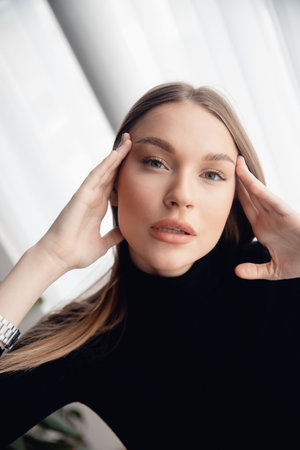 Caucasian Fashion portrait of beautiful young woman with green eyes white background. Concept beauty...