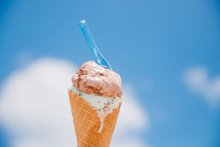 Hand man holds Italian ice cream on background of Grand Canal and Handol in Venice, Italy. Concept...