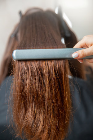 Concept lamination, lifting. Keratin recovery hair and protein treatment pile with professional ultrasonic iron toolの写真素材