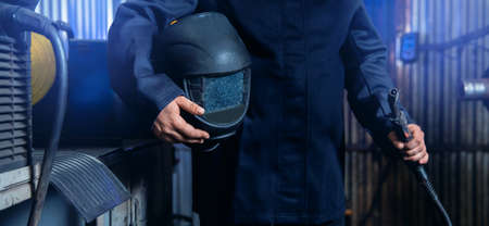 Industry banner, professional worker welder in protect mask use erecting technical iron at workの写真素材