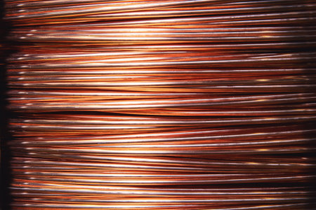 Closeup texture copper cable rolled coil up on industry factory