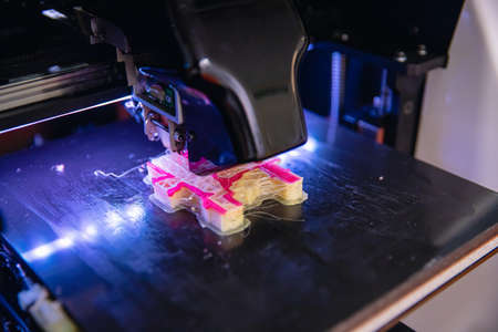 Macro photo Robot Modern 3D plastic printer printing figureの写真素材