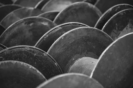 Empty metal copper coil spools for winding wire or cable into reelの写真素材