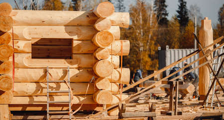 Timber building house construction circle log with blue sky sun lightの写真素材