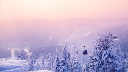 Landscape on mountain Sheregesh ski lift resort in winter sunset, aerial top view Kemerovo region Russiaの写真素材