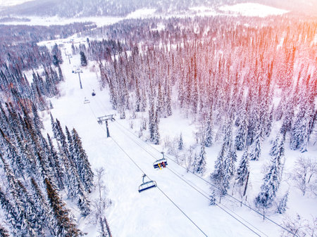 Landscape on mountain Sheregesh ski lift resort in winter sunset, Kemerovo region Russia aerial top viewの写真素材