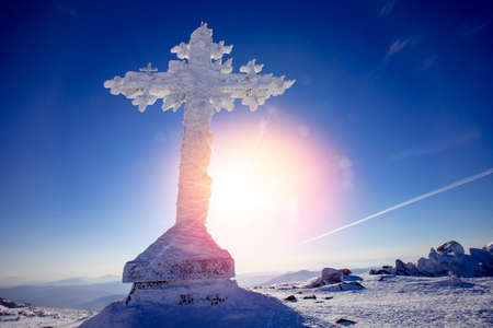 Cold landscape worship cross mountain Kemerovo region Russia in winter forestの写真素材