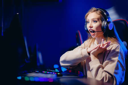 woman streamer play on online video game tournament, neon colorの写真素材