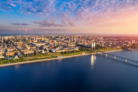 Aerial top view panorama city Perm and central embankment of Kama river Russia, sunset drone photoの写真素材