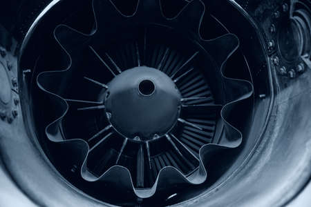 Closeup detail of turbine airplane engine blades outlet nozzle, toning blue colorの写真素材