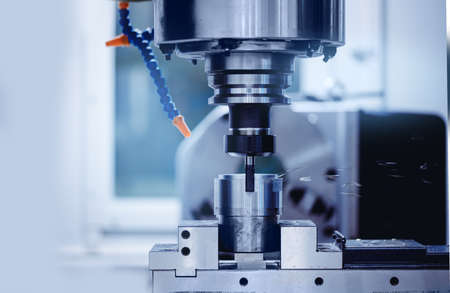 Macro photo industry CNC drill robot turning milling factory metal machineの写真素材