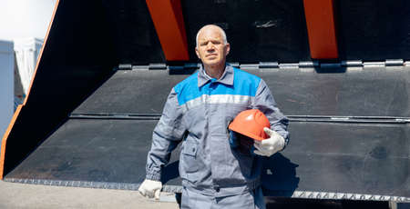 Driver man of construction equipment excavator or tractor build or open coal mine industrial workの写真素材
