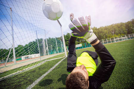 Goalkeeper soccer man didnt catch ball after penaltyの写真素材