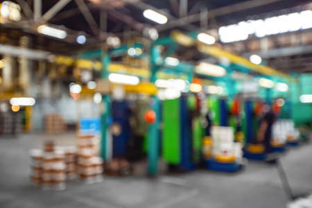 Factory workshop, abstract industrial metal plant blur backgroundの写真素材