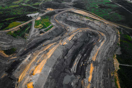 Aerial top view Open pit mine, extractive industry for coal mineral truckの写真素材