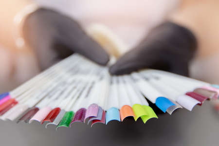 Concept choosing color of gel polish for applying manicure on client nailsの写真素材