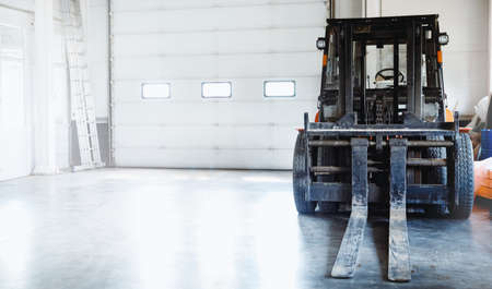 Logistics concept, industrial forklift in warehouse loader storeの写真素材