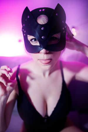 Portrait of sexy beautiful woman in leather cat mask for bdsm gamesの写真素材