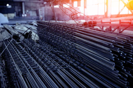 Storage steel metal with structural material on shelves in building warehouse. Industrial distribution background, blue color toneの写真素材