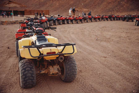Concept extreme travel ATV sport. Safari team quad bikes in desert Sharm Hurghada Cairo, Egyptの写真素材