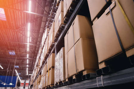 Background photo interior warehouse with carton box retail stock or postal centerの写真素材