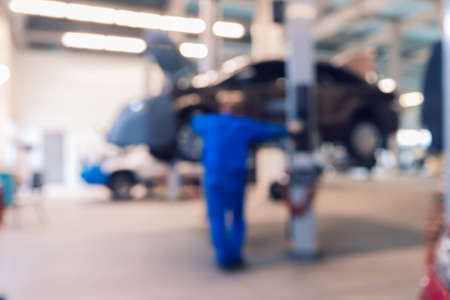 Blurred no focus background repair car service auto on liftの写真素材