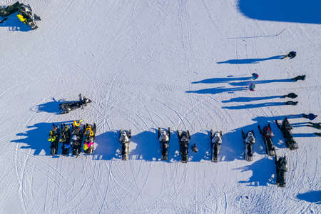 Winter snowmobile parking, group friends are preparing to go trip snow, aerial top viewの写真素材