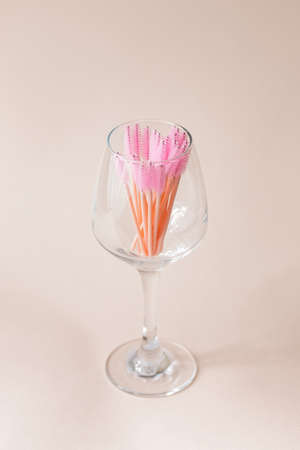 Set of pink brushes in glass on light background. Flat lay copy space beauty fashionの写真素材