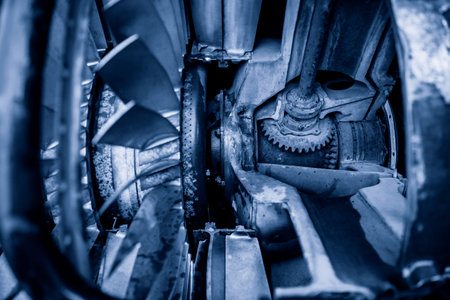 Closeup jet engine blades of airplane. Blue color toneの写真素材