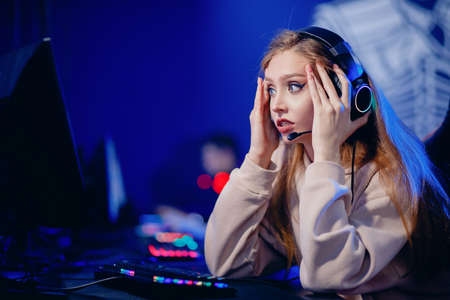 Facepalm streamer caucasian woman fail losing play gamer playing online video games computer emotions aggression, neon colorの写真素材