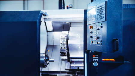 Manual labor automation, modern technologies. Control panel CNC Industrial drill robot for detail machine factoryの写真素材