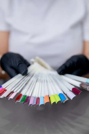 Set color of gel polish for applying manicure on client nailsの写真素材