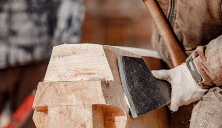 Carpenter worker with log wooden. Woodwork job, house frame buildingの写真素材