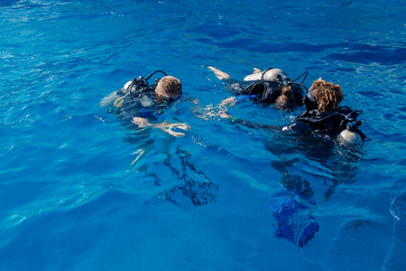 Team divers man with scuba diving blue water sea. Concept travel extreme sportの写真素材