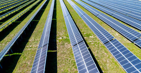 Aerial view of solar panel, photovoltaic, alternative electricity source. Banner Power farm producing clean green energyの写真素材