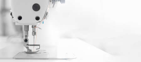 Banner industry tailor sewing machine on table workshop of white backgroundの写真素材