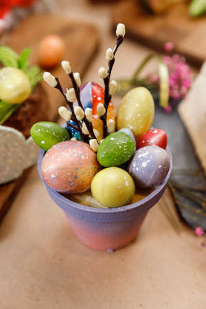 Easter table orthodox sweet bread, kulich with chocolate eggs and rabbit. Variety pastries for holidayの写真素材